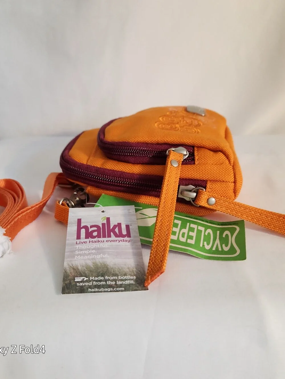 Haiku Orange Crossbody with Plum Trim and Embroidered Swirls